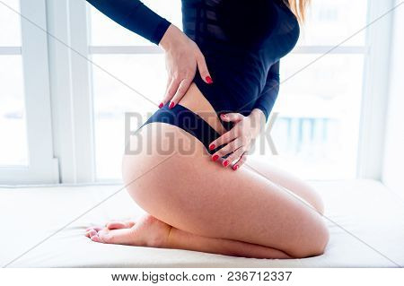A Portrait Of A Beauriful Woman In A Lingerie
