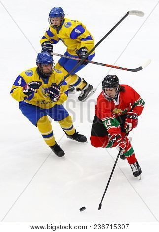 Kyiv, Ukraine - April 17, 2018: Bence Dezsi Of Hungary (red) Fights For A Puck With Danylo Babchuk A