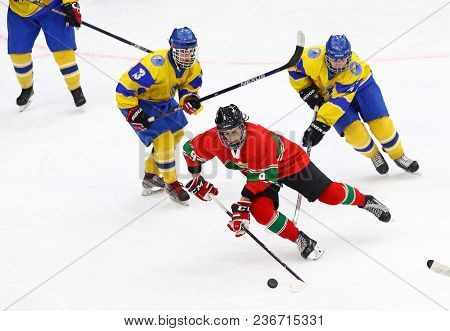 Kyiv, Ukraine - April 17, 2018: Mark Almasi Of Hungary (c) Fights For A Puck With Davyd Ivashchenko 