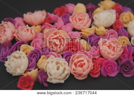 Mix Of Pink And Peach Fake Plastic Mini Rosess Flowers Black Background Copy Space. Craft, Art,