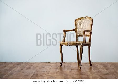 Old Chair On A Gray Wall Background