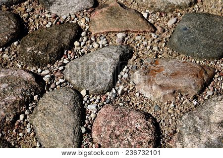 The Road, A Pedestrian Path Made Of Stones Of Different Shapes. Background