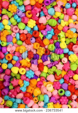 Background Of Tiny Fashion Accessories To Create Necklaces And Bracelets For Children