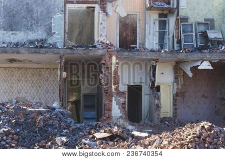 View Of A Dilapidated House. The Destroyed Walls In The Process Of Demolishing The Dilapidated House