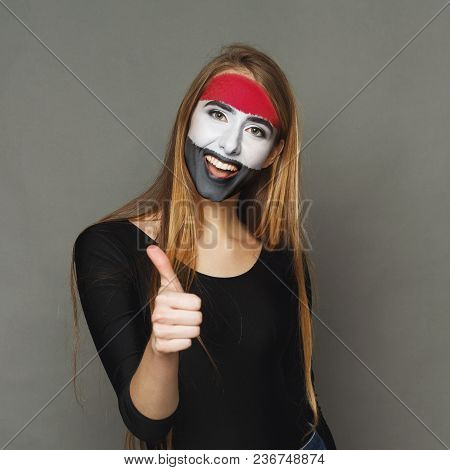 Face Of Young Happy Woman Painted With Flag Of Egypt. Football Or Soccer Team Fan, Sport Event, Face