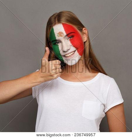 Face Of Young Happy Woman Painted With Flag Of Mexica. Football Or Soccer Team Fan, Sport Event, Fac