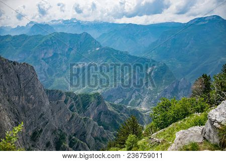The Tops Of The Picturesque Mountains Are Covered With White Snow.