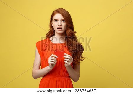 Attractive Ginger Girl Holding Paper Heart And Frowning, Being Nervous While Confessing To Her Crush