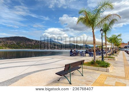 Kefalonia, Greece - September 30, 2017: Bench And Palm Trees On Coastal Promenade In Argostoli. Gree