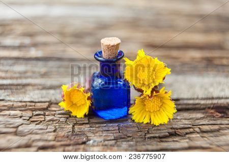 Foalfoot Essential Oil In  Beautiful Bottle On Table