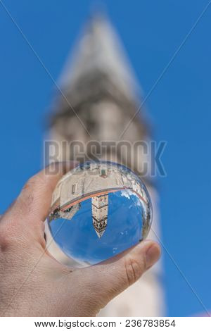 Saint Nikola Church Tower Reflected In A Glass Ball Held By A Tourist, Perast, Kotor Harbor, Montene