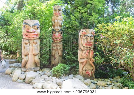 Indian Totem Poles In Capilano Suspension Bridge In Vancouver, Canada