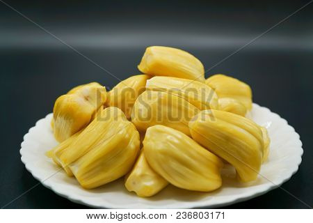 Fresh Jackfruit Slices On A White Plate. Sweet Yellow Jackfruit Ripe. Vegetarian, Vegan, Raw Food. E