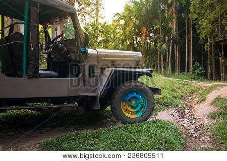 Truck On A Bad Road. Military Suv In The Woods Off-road. Open Car For Safari In India Or Africa