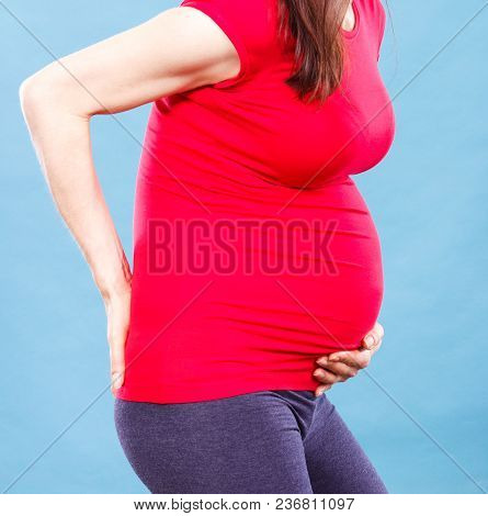 Woman In Pregnant With Stomach Pain Or Back Aches, Concept Of Health Care, Suffering, Nausea Or Indi