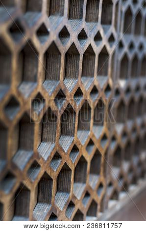 The Texture Of A Modern Wall With Multi-faceted Holes. Selective Focus.