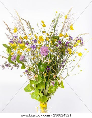 Festive Bouquet Of Yellow And Purple Wildflowers, Herbs On A White Background.