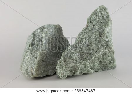 Close-up Of Two Raw Jade Mineral Stones, Isolated On White Background