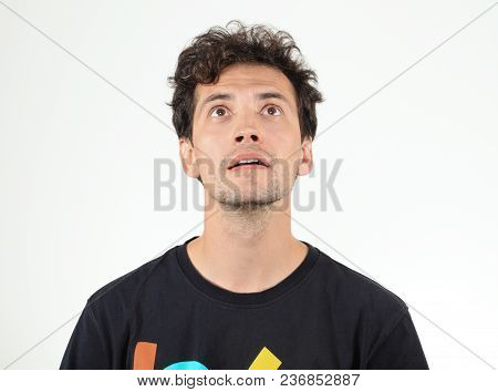 Nice Man Wearing In T-shirt Looking Up
