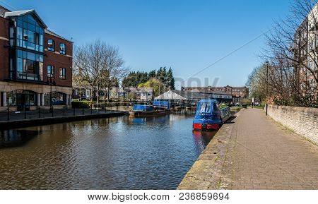 The Sunny Towpath Of The Canal As It Runs Through The Centre Of Wigan