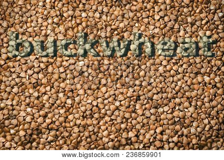 Texture Of Fresh Clean Useful Buckwheat Groats Grain Close-up. Healthy Dietary Food Rich In Microele
