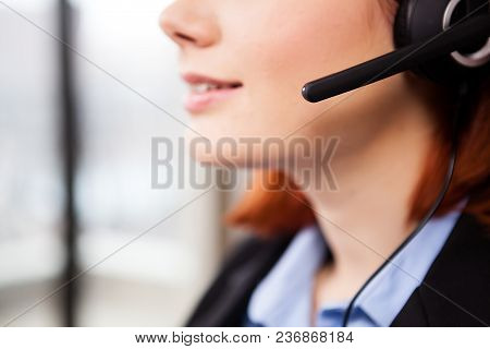 Close Up Of Unrecognisable Woman Speaking In The Headset. Telemarketing And Customers Support