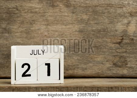 White Block Calendar Present Date 21 And Month July On Wood Background