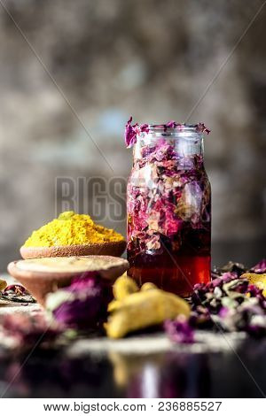 Ayurvedic Ubtan Of Haldi With Holy Rose Water And Fuller’s Earth On Wooden Surface For Good, Brighte