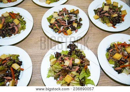 Healthy Salads Made Of Hot Beef And Fresh. A Few Plates