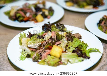 Healthy Salads Made Of Hot Beef And Fresh. A Few Plates