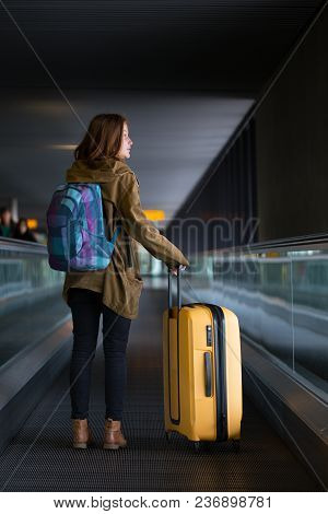 The Girl Is Riding On The Travolator