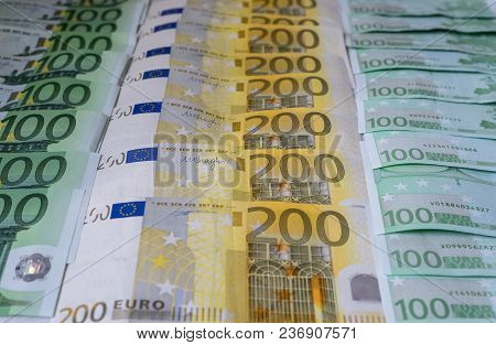 Scattered 200 Euro, 100 Euro, Banknotes, European Currency - Background.