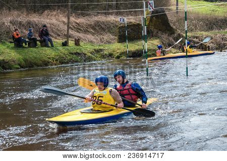 Grodno, Belarus - April, 2018: Kayak Freestyle Competition On Fast Cold Water River Strenuously Rowi