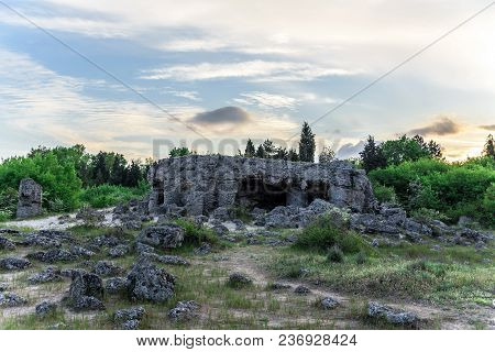 Magnificent Landscape Of Abstract Stones On A Hill At Sunset.