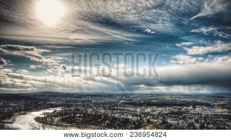 Beautiful City View With Blue Sky, Sun And Rain Clouds
The City Of Koblenz In Germany