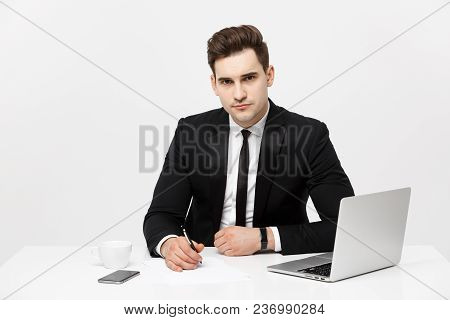 Portrait Of Confident Manager Sitting At Desk And Looking At Camera. Portrait Of Business Man Workin