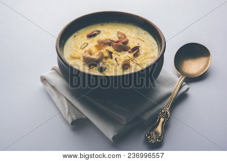Kheer Or Rice Pudding Is An Indian Dessert In A Brown Terracotta Bowl With Dry Fruits Toppings