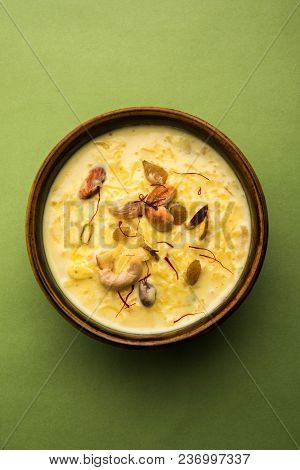 Kheer Or Rice Pudding Is An Indian Dessert In A Brown Terracotta Bowl With Dry Fruits Toppings