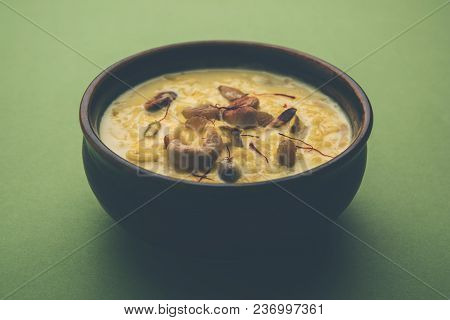 Kheer Or Rice Pudding Is An Indian Dessert In A Brown Terracotta Bowl With Dry Fruits Toppings