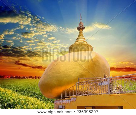 The Replica Of Phra That In-kwaen (hanging Golden Rock) With Sunset Background, At Koh (islands) Sir