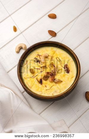 Kheer Or Rice Pudding Is An Indian Dessert In A Brown Terracotta Bowl With Dry Fruits Toppings