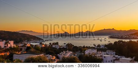 Bright Colorful Sunset In The Beautiful Bay Of The Aegean Sea With Islands, Mountains And Boats. Sum