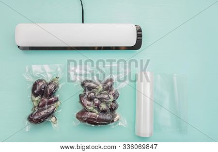 Plastic Sealing Machine. Vacuum Packaging Of Fresh Tomatoes. Vacuum Packaging Fresh Eggplant For Sto