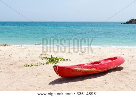 Red Mini Boat On The Beach And Sea