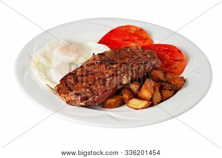 Isolated Steak And Eggs With Grilled Sliced Tomato