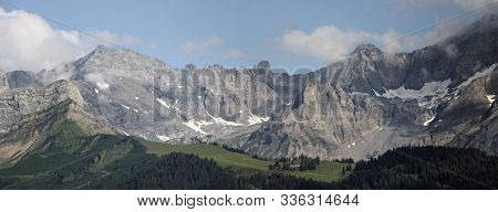 Alpine Scenery With Forest Ridge And Mountain