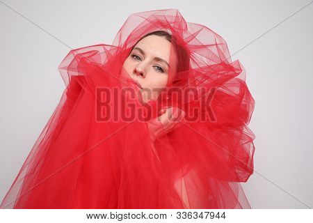 Stylish Young Woman Posing In The Studio. Close-up Portrait. White Background.