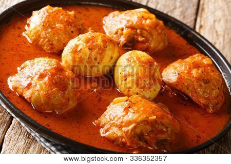Doro Wat Is Ethiopian Stew Of Chicken Thighs With Eggs In A Spicy Sauce Close-up In A Plate. Horizon