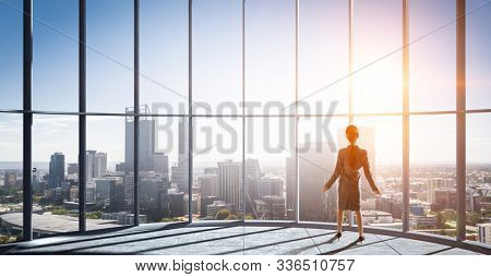 Businesswoma in office interior. Mixed media