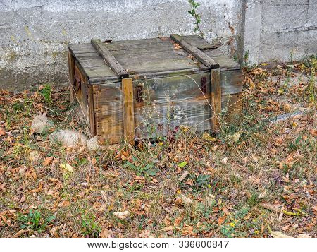 Old Degraded Military Crate Outside Conceptual Photo